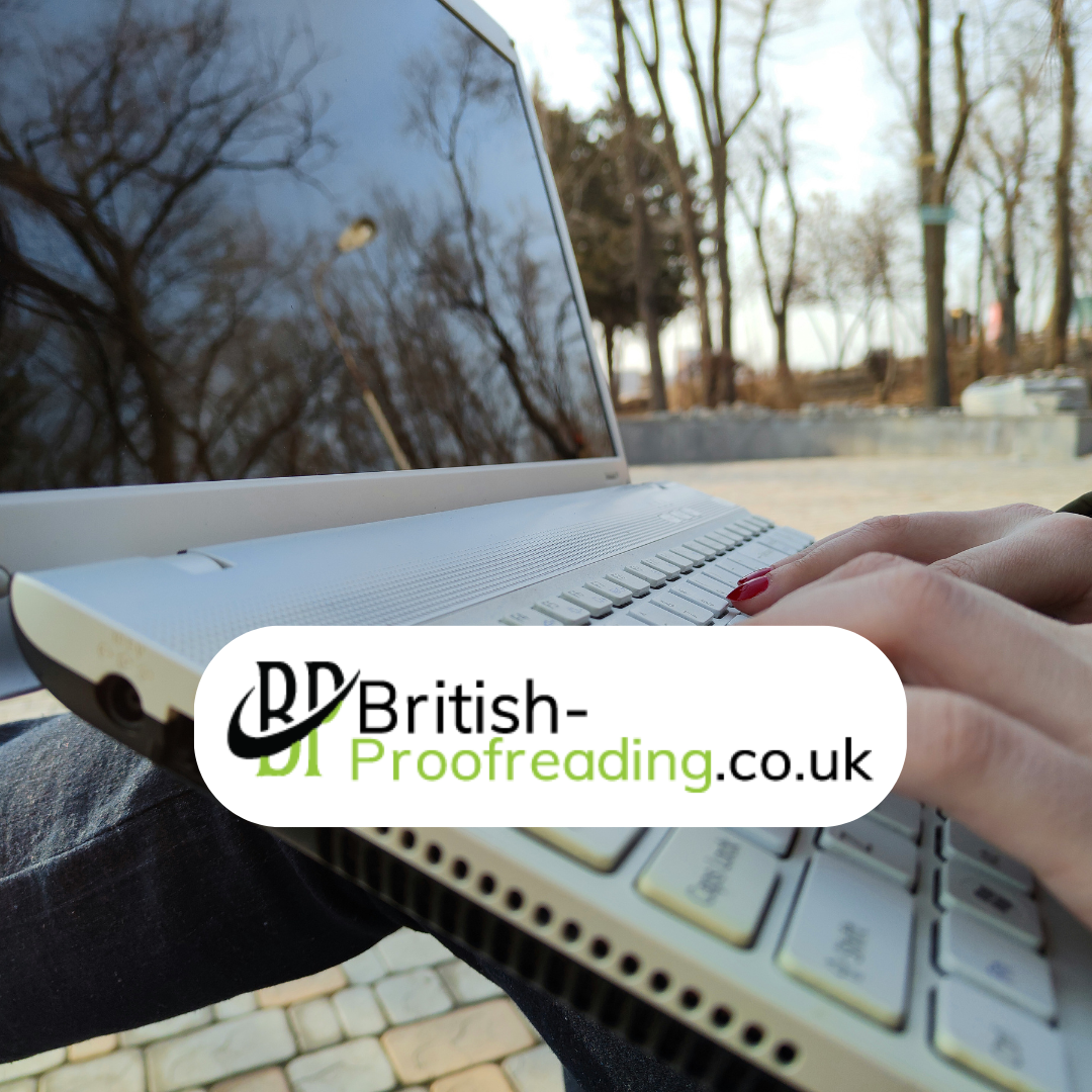 Student sitting at desk proofreading printed thesis pages on laptop